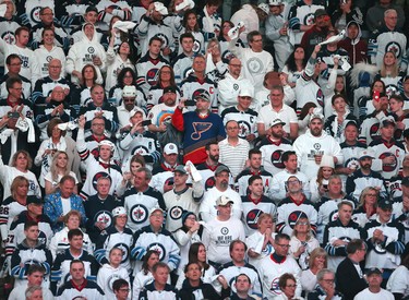 WINNIPEG, MANITOBA - APRIL 10: Winnipeg Jets fans bring on the 'whiteout' as the Winnipeg Jets took on the St. Louis Blues in Game One of the Western Conference First Round during the 2019 NHL Stanley Cup Playoffs at Bell MTS Place on April 10, 2019 in Winnipeg, Manitoba, Canada. (Photo by Jason Halstead/Getty Images) *** Local Caption ***