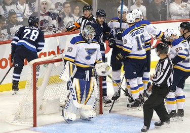 WINNIPEG, MANITOBA - APRIL 10: Jordan Binnington #50 of the St. Louis Blues holds the puck after making a save against the Winnipeg Jets in Game One of the Western Conference First Round during the 2019 NHL Stanley Cup Playoffs at Bell MTS Place on April 10, 2019 in Winnipeg, Manitoba, Canada. (Photo by Jason Halstead/Getty Images)