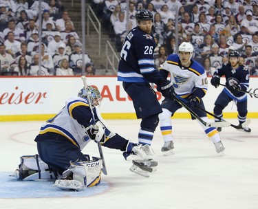 WINNIPEG, MANITOBA - APRIL 10: Jordan Binnington #50 of the St. Louis Blues makes a save in front of Blake Wheeler #26 of the Winnipeg Jets in Game One of the Western Conference First Round during the 2019 NHL Stanley Cup Playoffs at Bell MTS Place on April 10, 2019 in Winnipeg, Manitoba, Canada. (Photo by Jason Halstead/Getty Images)