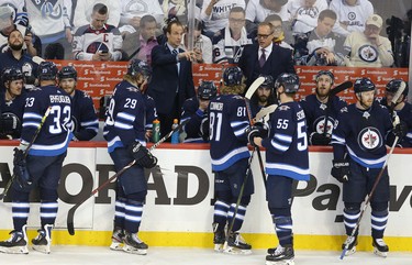 WINNIPEG, MANITOBA - APRIL 10: Associate coach Jamie Kompon (left) and head coach Paul Maurice of the Winnipeg Jets during a time-out in action against the St. Louis Blues in Game One of the Western Conference First Round during the 2019 NHL Stanley Cup Playoffs at Bell MTS Place on April 10, 2019 in Winnipeg, Manitoba, Canada. (Photo by Jason Halstead/Getty Images)