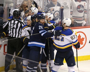 WINNIPEG, MANITOBA - APRIL 10: Blake Wheeler #26 of the Winnipeg Jets grabs Alex Pietrangelo #27 of the St. Louis Blues in Game One of the Western Conference First Round during the 2019 NHL Stanley Cup Playoffs at Bell MTS Place on April 10, 2019 in Winnipeg, Manitoba, Canada. (Photo by Jason Halstead/Getty Images)