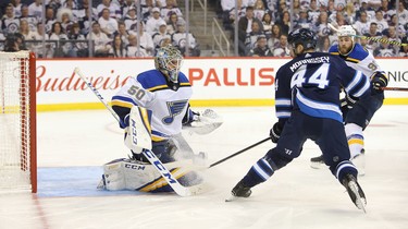 WINNIPEG, MANITOBA - APRIL 10: Jordan Binnington #50 of the St. Louis Blues makes a save in front of Josh Morrissey #44 of the Winnipeg Jets in Game One of the Western Conference First Round during the 2019 NHL Stanley Cup Playoffs at Bell MTS Place on April 10, 2019 in Winnipeg, Manitoba, Canada. (Photo by Jason Halstead/Getty Images)