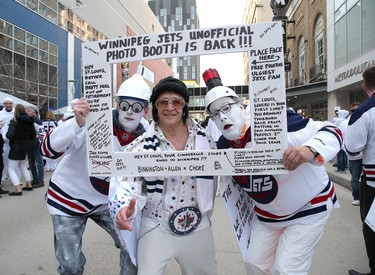 WINNIPEG, MANITOBA - APRIL 10: From left, fans Rob McFaddin, Irv Simmonds and Del Pannu enjoy themselves at a street party before the Winnipeg Jets took on the St. Louis Blues in Game One of the Western Conference First Round during the 2019 NHL Stanley Cup Playoffs at Bell MTS Place on April 10, 2019 in Winnipeg, Manitoba, Canada. (Photo by Jason Halstead/Getty Images)