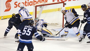 WINNIPEG, MANITOBA - APRIL 10: Alex Pietrangelo #27 of the St. Louis Blues follows a loose puck under his goalie Jordan Binnington #50 as Winnipeg Jets look for the rebound in Game One of the Western Conference First Round during the 2019 NHL Stanley Cup Playoffs at Bell MTS Place on April 10, 2019 in Winnipeg, Manitoba, Canada. (Photo by Jason Halstead/Getty Images)