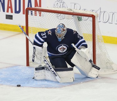 WINNIPEG, MANITOBA - APRIL 10: Connor Hellebuyck #37 of the Winnipeg Jets makes a save against the St. Louis Blues in Game One of the Western Conference First Round during the 2019 NHL Stanley Cup Playoffs at Bell MTS Place on April 10, 2019 in Winnipeg, Manitoba, Canada. (Photo by Jason Halstead/Getty Images)