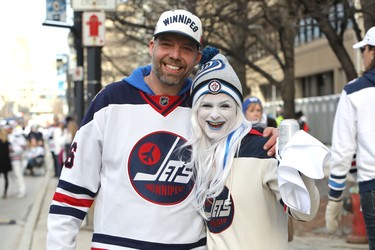 WINNIPEG, MANITOBA - APRIL 10: Fans Jeremy and Kristen Miller enjoy themselves at a street party before the Winnipeg Jets took on the St. Louis Blues in Game One of the Western Conference First Round during the 2019 NHL Stanley Cup Playoffs at Bell MTS Place on April 10, 2019 in Winnipeg, Manitoba, Canada. (Photo by Jason Halstead/Getty Images)