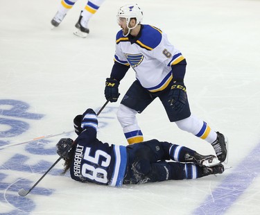 WINNIPEG, MANITOBA - APRIL 10: Joel Edmundson #16 of the St. Louis Blues levels Mathieu Perreault #85 of the Winnipeg Jets in Game One of the Western Conference First Round during the 2019 NHL Stanley Cup Playoffs at Bell MTS Place on April 10, 2019 in Winnipeg, Manitoba, Canada. (Photo by Jason Halstead/Getty Images)