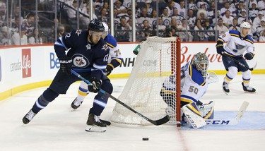 WINNIPEG, MANITOBA - APRIL 10: Kevin Hayes #12 of the Winnipeg Jets looks for a wrap-around against Jordan Binnington #50 of the St. Louis Blues in Game One of the Western Conference First Round during the 2019 NHL Stanley Cup Playoffs at Bell MTS Place on April 10, 2019 in Winnipeg, Manitoba, Canada. (Photo by Jason Halstead/Getty Images)