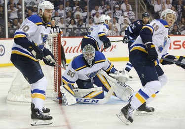 WINNIPEG, MANITOBA - APRIL 10: Jordan Binnington #50 of the St. Louis Blues follows the puck in Game One of the Western Conference First Round against the Winnipeg Jets during the 2019 NHL Stanley Cup Playoffs at Bell MTS Place on April 10, 2019 in Winnipeg, Manitoba, Canada. (Photo by Jason Halstead/Getty Images)