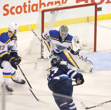 WINNIPEG, MANITOBA - APRIL 10: Jordan Binnington #50 of the St. Louis Blues makes a save off Nikolaj Ehlers #27 of the Winnipeg Jets in Game One of the Western Conference First Round during the 2019 NHL Stanley Cup Playoffs at Bell MTS Place on April 10, 2019 in Winnipeg, Manitoba, Canada. (Photo by Jason Halstead/Getty Images)