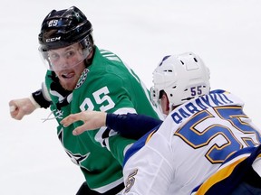 Stars’ Brett Ritchie (left) prepares to punch Blues’ Colton Parayko during a February game in Dallas. After surviving all sorts of in-season turmoil, the two teams will meet in the second round of the Stanley Cup playoffs. GETTY IMAGES
