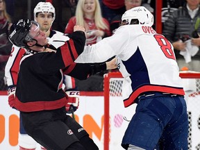 Alex Ovechkin of the Washington Capitals knocks out Andrei Svechnikov of the Carolina Hurricanes as they fight at PNC Arena on April 15, 2019 in Raleigh, North Carolina. (Grant Halverson/Getty Images)