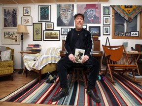 Singer-songwriter Scott Nolan poses with his debut poetry collection, Moon Was a Feather, in his St. James home on Wed., April 3, 2019. Kevin King/Winnipeg Sun/Postmedia Network
