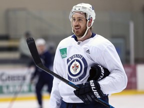 Kevin Hayes smiles at a teammate during Winnipeg Jets practice at Bell MTS Iceplex on Monday, April 8