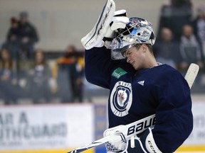 Eric Comrie puts his mask back on during Winnipeg Jets practice at Bell MTS Iceplex on Mon., April 8, 2019. Kevin King/Winnipeg Sun/Postmedia Network