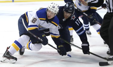 Winnipeg Jets centre Adam Lowry (right) and St. Louis Blues centre Robert Thomas battle in the face-off circle during Game 1 of Round 1 of the NHL playoffs in Winnipeg on Wed., April 10, 2019. Kevin King/Winnipeg Sun/Postmedia Network