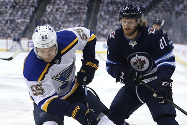 Winnipeg Jets forward Kyle Connor (right) pressures St. Louis Blues defenceman Colton Parayko during Game 1 of Round 1 of the NHL playoffs in Winnipeg on Wed., April 10, 2019. Kevin King/Winnipeg Sun/Postmedia Network