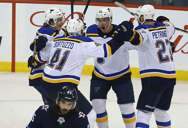 St. Louis Blues centre Tyler Bozak (second from right) celebrates his game-winning goal against the Winnipeg Jets during Game 1 of Round 1 of the NHL playoffs in Winnipeg with Robert Thomas, Robert Bortuzzo and Alex Pietrangelo (from left) on Wed., April 10, 2019. Kevin King/Winnipeg Sun/Postmedia Network