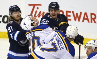 Winnipeg Jets centre Mark Scheifele (centre) and forward Kyle Connor (left) battle with St. Louis Blues forward Alexander Steen during Game 1 of Round 1 of the NHL playoffs in Winnipeg on Wed., April 10, 2019. Kevin King/Winnipeg Sun/Postmedia Network