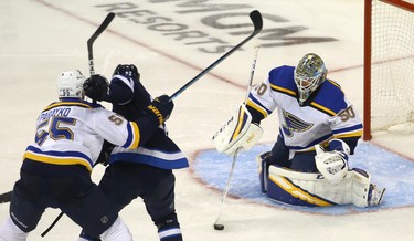 St. Louis Blues goaltender Jordan Binnington pushes the puck aside as defenceman Colton Parayko slows Winnipeg Jets forward Par Lindholm during Game 1 of Round 1 of the NHL playoffs in Winnipeg on Wed., April 10, 2019. Kevin King/Winnipeg Sun/Postmedia Network