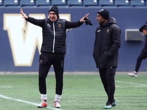 Head coach Rob Gale (left), with assistant Damien Rocke, gestures during Valour FC practice at Investors Group Field in Winnipeg on Monday.