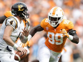 Winnipeg selected Jonathan Kongbo (right) in the first round of Thursday's CFL draft. (GETTY IMAGES)