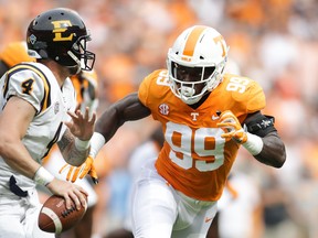 Winnipeg selected Jonathan Kongbo (right) in the first round of Thursday's CFL draft. (GETTY IMAGES)