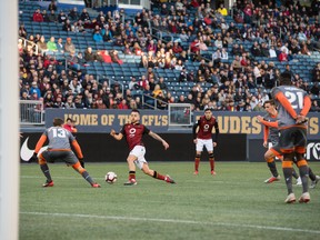 Valour FC’s Marco Busto (right) looks to make a move against Forge FC last night.   David Lipnowski/photo