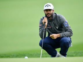 Adam Hadwin lines up a putt on the 11th green during the first round of the PGA Championship at the Bethpage Black course in Farmingdale, N.Y., on Thursday, May 16, 2019.