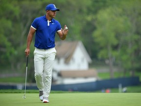 Brooks Koepka reacts to his birdie putt on the 15th green during the second round of the PGA Championship at the Bethpage Black course in Farmingdale, N.Y., on Friday, May 17, 2019.