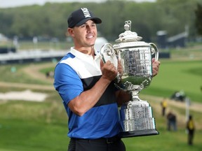 Brooks Koepka poses with the Wanamaker Trophy after winning the PGA Championship at the Bethpage Black course in Farmingdale, N.Y., on Sunday, May 19, 2019.
