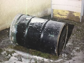 A barrel is seen in a Winnipeg yard in this undated handout photo provided by Manitoba Court of Queen's Bench. Perez Cleveland, 46, has pleaded not guilty in the death of 42-year-old Jennifer Barrett, whose body was found in a barrel behind their Winnipeg home in December 2016.