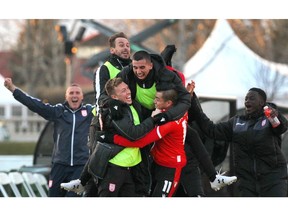 Cavalry FC Jose Escalante celebrates his game-winning goal with teammates over Valour FC at Atco Field in Spruce Meadows in Calgary on Wednesday. Cavalry FC won 1-0. Photo by Jim Wells/Postmedia.