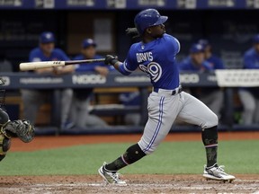 Jays’ Jonathan Davis slugs a two-run homer off Tampa reliever Hunter Woodon Monday.  AP PHOTO