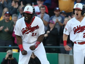 Josh Romanski (right) drove in a run during Tuesday's win over the T-Bones. (KEVIN KING/ WINNIPEG SUN FILES)