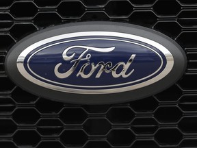 In this Feb. 17, 2019, file photo the company logo is displayed on the grille of an unsold 2019 F150 pickup truck at a Ford dealership in Broomfield, Colo.