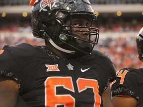 Oklahoma State offensive lineman Shane Richards walks the field prior to a game in Stillwater, Okla., Saturday, Sept. 8, 2018. (THE CANADIAN PRESS/AP/Brody Schmidt)