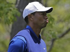 Tiger Woods reacts on the eighth hole during the first round of the PGA Championship at Bethpage Black in Farmingdale, N.Y., Thursday, May 16, 2019.