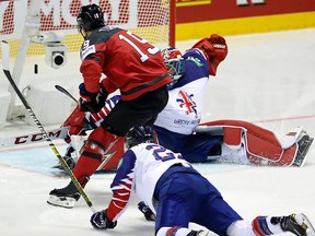 Canada's Kyle Turris, left, scores his sides third goal past Great Britain's goaltender Ben Bowns, right, during the Ice Hockey World Championships group A match between Great Britain and Canada at the Steel Arena in Kosice, Slovakia, Sunday, May 12, 2019.