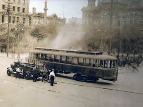 A street car burns during the Winnipeg General Strike in 1919. The blaze is thought to have been set by a woman. Archives of Manitoba photo