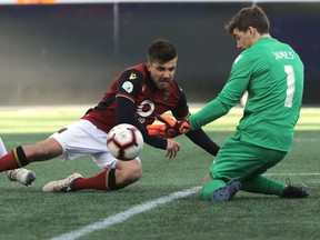 Winnipeg Valour FC's Michael Petrasso is stopped by Edmonton goalkeeper Connor James during Canadian Premier League soccer action in Winnipeg between Valour FC and FC Edmonton. Saturday, May 04/2019 Edmonton won 2-1. Winnipeg Sun/Chris Procaylo/stf