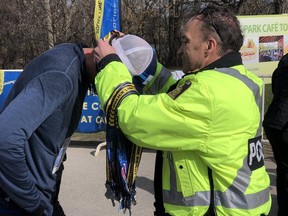 Winnipeg Chief of Police Danny Smyth presents medals at the conclusion of the Foodfare Winnipeg Police Service Half Marathon, 2-Person Relay and 5K at Assiniboine Park on Sunday, May 5, 2019. The 15th annual event raised $170,000 to support brain cancer research.