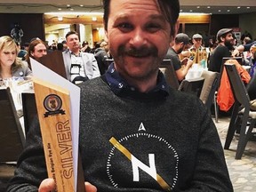 Mark Borowski, head brewer at Nonsuch Brewing, holds the silver trophy awarded to its 350 Orange Chocolate Belgian Rye Ale at the Canadian Brewing Awards in Toronto.