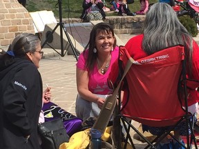 The First Nations Family Advocate at the Assembly of Manitoba Chiefs, Cora Morgan (centre) addresses two of the participants at the Grandmothers Walk on Friday at the Oodena Celebration Circle at The Forks.