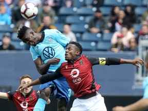 Halifax Wanderers FC`s Andre Bona (left) in action with Valour FC captain Jordan Murrell, in Winnipeg on Saturday May 11.
