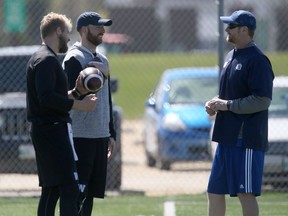 CFL Winnipeg Blue Bombers quarterbacks Chris Streveler (left), and Matt Nichols, talk to head coach Mike O'Shea in Winnipeg.
Friday, May 17, 2019. 
Chris Procaylo/Winnipeg Sun/Postmedia Network