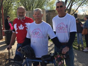 (Left to right) Rick Stephens, Dr. Paul Harrison and Kelly Harrison following the completion of their 1,000-mile Bridget's Wreath Ride for Eating Disorder Awareness and Therapy bicycle ride from Wichita, Kansas, to Winnipeg to advance research and treatment options for the eating disorder that ended the life of Dr. Harrison's daughter on Monday at The Forks in Winnipeg.