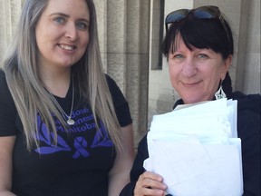 Rebecca Rummery (left) and Arlene Last-Kolb of Overdose Awareness Manitoba at the Manitoba Legislative Building in Winnipeg on Friday, May 17, 2019, with the petition calling on the Manitoba provincial government to create more long-term medically assisted detox facilities, affordable long-term treatment with no wait list, and more on-going supports for people suffering with substance use disorder. The group collected over 5,000 signatures on the petition in just over a month.