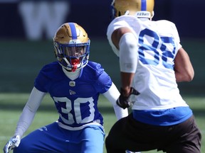 Winston Rose (left) covers Rasheed Bailey during Winnipeg Blue Bombers training camp at IG Field on Tuesday.