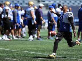 Justin Medlock punts during Winnipeg Blue Bombers training camp at IG Field on Monday.